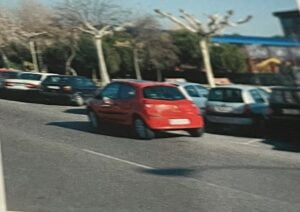 test carnet de conducir - coche rojo doble fila